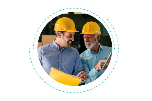 Two construction workers reviewing plans