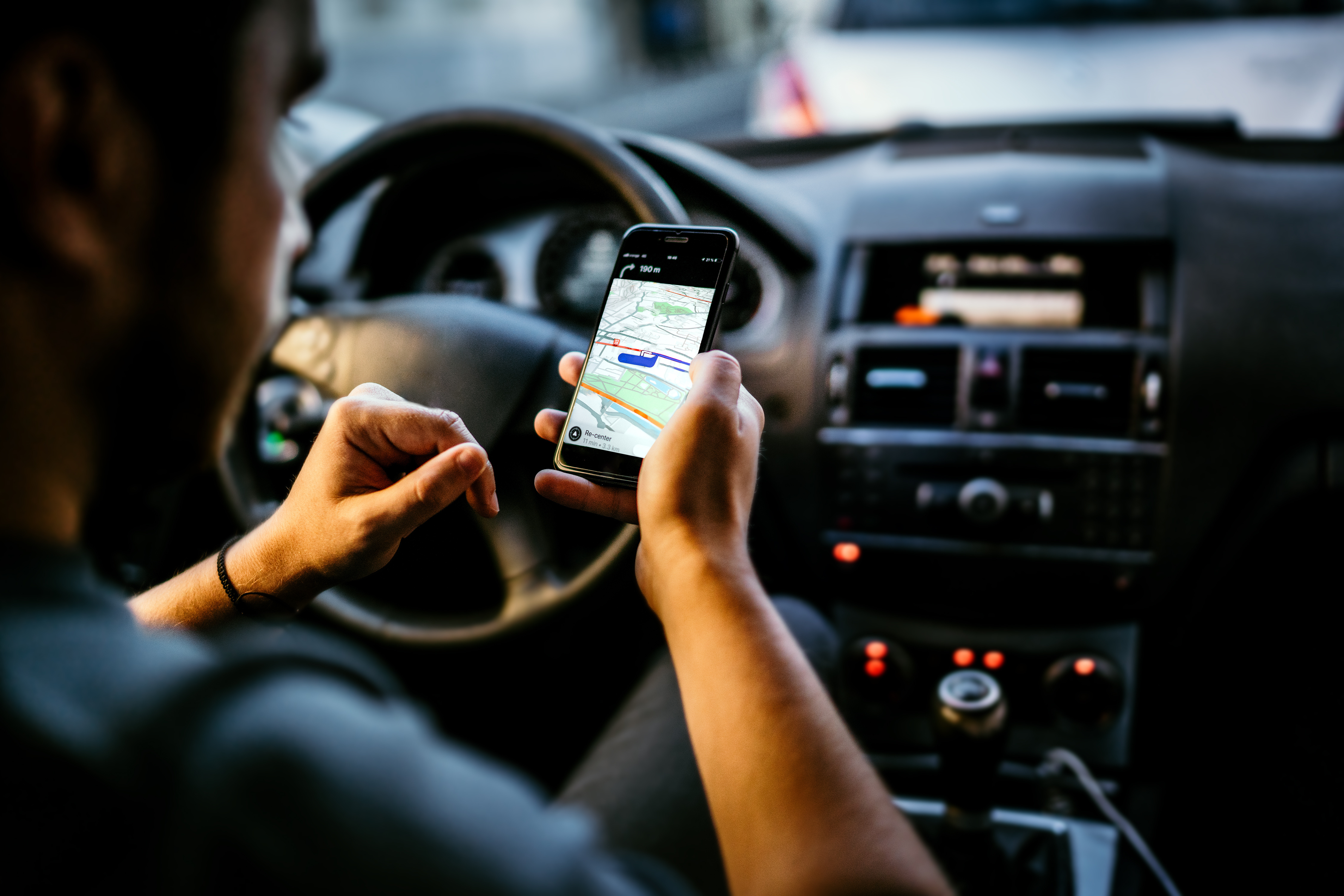 Mobile Phone vs. Vehicle GPS Tracker